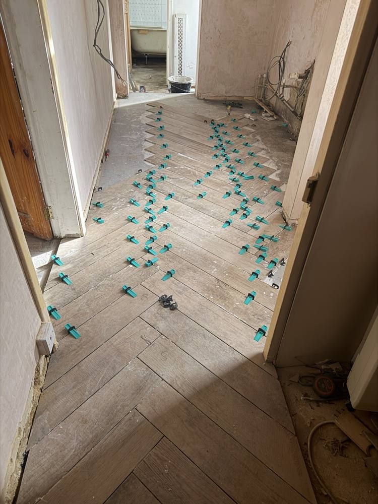 Herringbone tiles on the levelled floor.